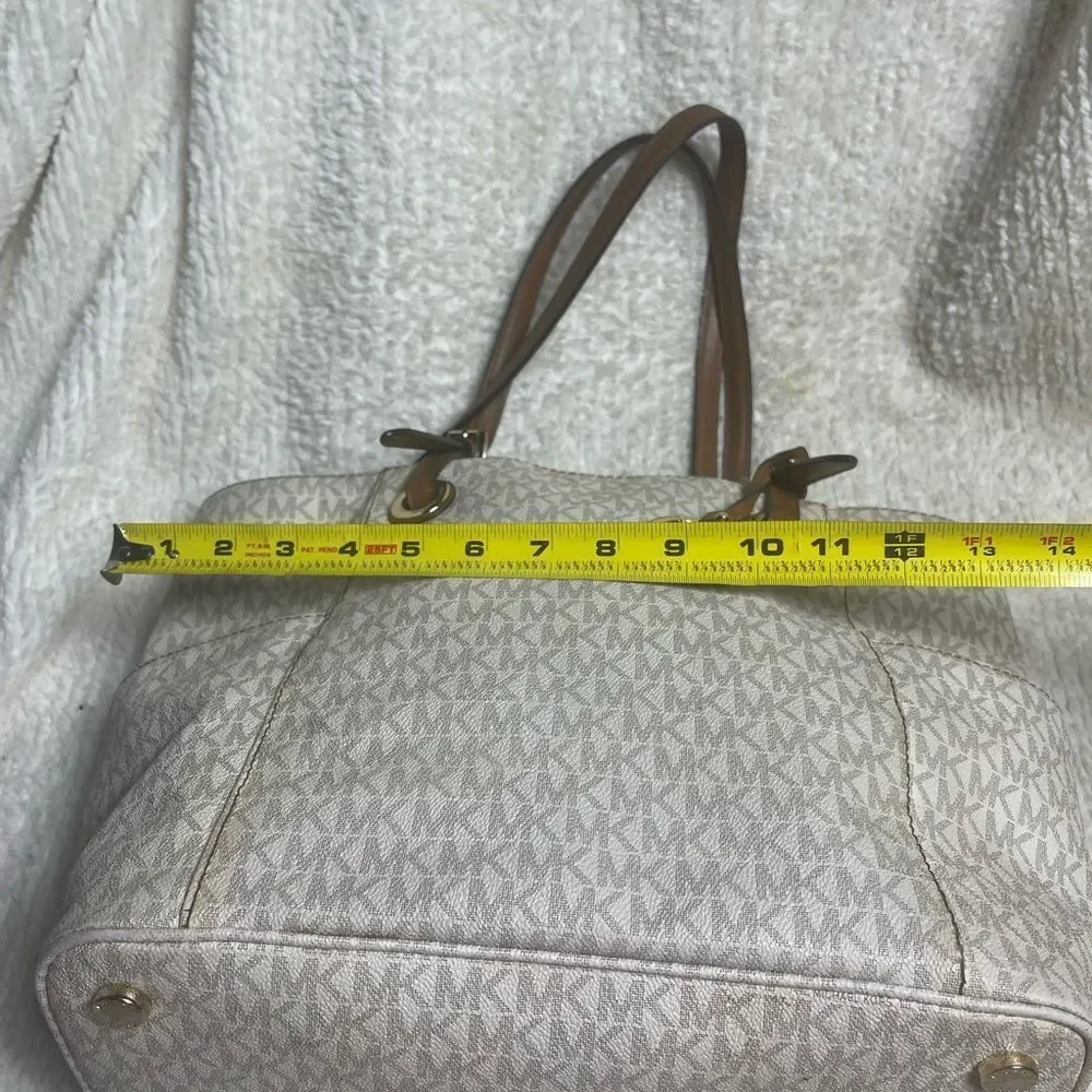 Michael Kors Beige signature Coated Canvas tote , tan leather straps .